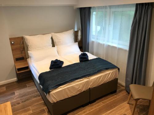 Ένα ή περισσότερα κρεβάτια σε δωμάτιο στο Stayhome Tossens