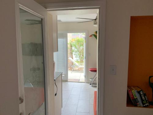 a hallway with a door leading into a room at ~ Cozy In-law Apartment Close to Siesta Key ~ in Sarasota