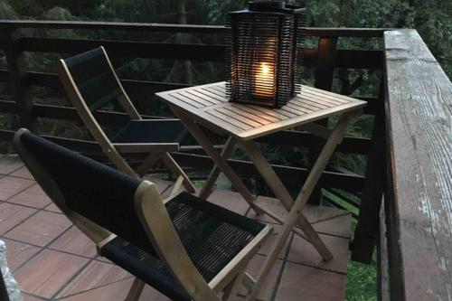 a small table with a candle on top of it at Chalet “In dai Guriuz” in Ravinis