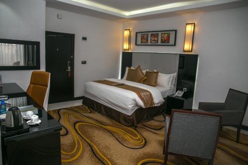 Ένα ή περισσότερα κρεβάτια σε δωμάτιο στο GreenPoint Hotel