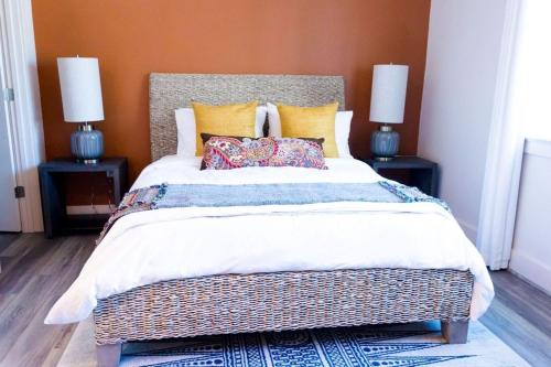 a bedroom with a large bed with two night stands at The Bishop Arts Hotel by Qresorts in Dallas