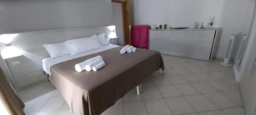 Ένα ή περισσότερα κρεβάτια σε δωμάτιο στο L’Arca - Bed & Breakfast in Lucera Centro