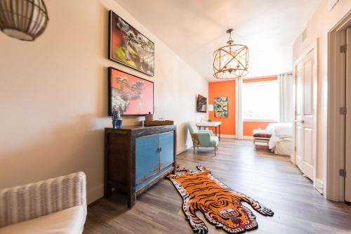 a living room with a tiger rug on the floor at The Bishop Arts Hotel by Qresorts in Dallas