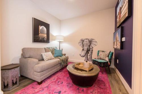 a living room with a couch and an elephant statue at The Bishop Arts Hotel by Qresorts in Dallas