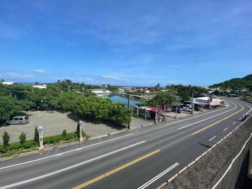 an empty highway with a view of a town at Wayu House in Dawu