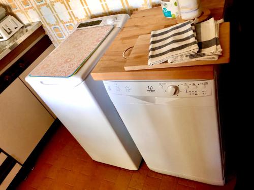 a kitchen with a counter top and a dishwasher at Chalet dell'Orso in Pescasseroli