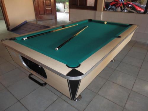 a pool table sitting on top of a floor at Hotel Garant & Suites in Boca Chica