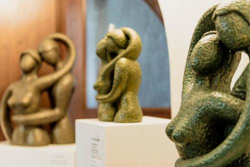 two statues of a dog on a display in a museum at Wohlfühlhotel Goiserer Mühle in Bad Goisern