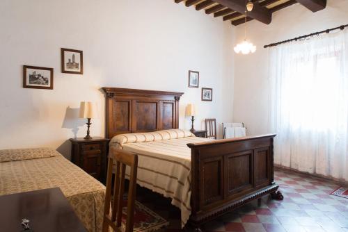 Letto o letti in una camera di Residenza D'Epoca Palazzo Buonaccorsi