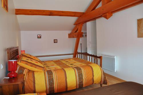 Säng eller sängar i ett rum på Gîte Chez ANTONIN
