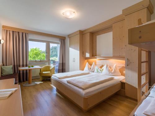 Postel nebo postele na pokoji v ubytování Aparthotel Brandauerhof
