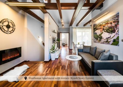 a living room with a couch and a fireplace at 5-stars Apartments - Old Town in Szczecin