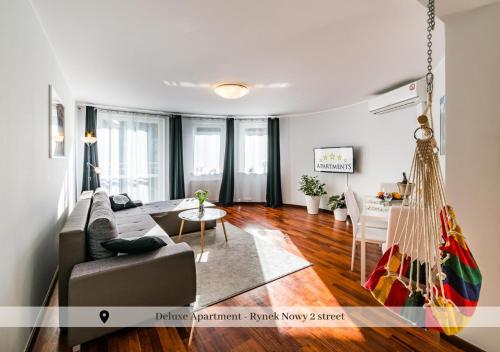 a living room with a couch and a hammock in it at 5-stars Apartments - Old Town in Szczecin