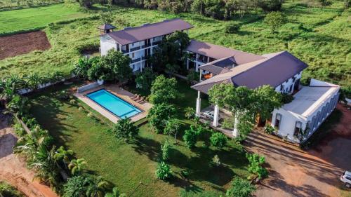 an aerial view of a house with a swimming pool at Four Points Resort - Anuradhapura in Anuradhapura