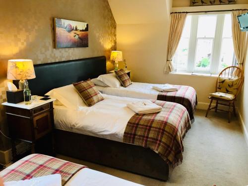 Krevet ili kreveti u jedinici u objektu Lairds Lodge Inverness