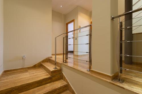 a hallway with wooden stairs in a building at Penthouse with Private Swimming Pool in Melenara