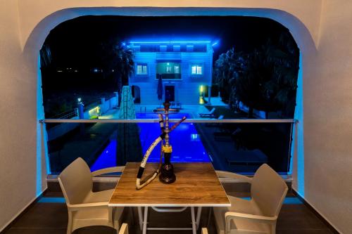 a table in a room with a view of a house at Villa on Kadriye Mahallesi in Belek