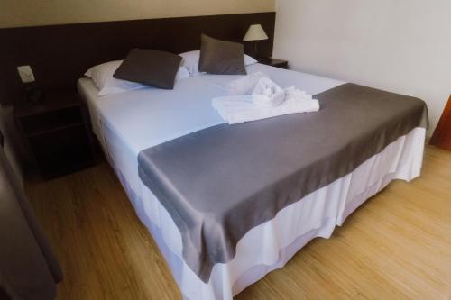 מיטה או מיטות בחדר ב-Alzira Granada Hotel