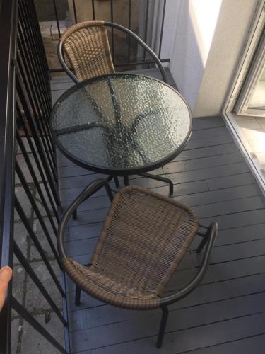 a table and a chair on a porch at Lviv Apartments in Lviv