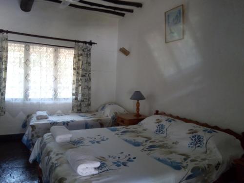 Postel nebo postele na pokoji v ubytování Glory Ocean Villas - Diani