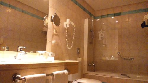 a bathroom with a shower and a sink and a shower at Parador de Alcañiz in Alcañiz