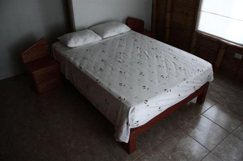 Säng eller sängar i ett rum på Posada del Mar Vichayito