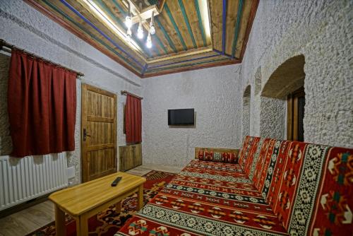 TV a/nebo společenská místnost v ubytování Cappa Cave Hotel