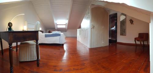 a bedroom with a bed and a table in a room at Estes in Crotone