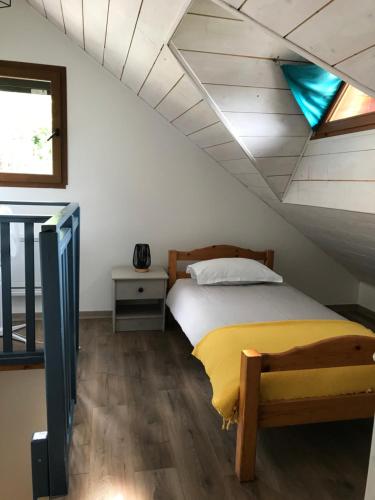 a bedroom with a bed in a attic at Chez Albert in Aiguebelette-le-Lac