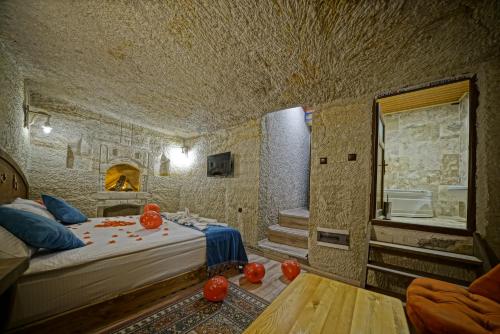 Postel nebo postele na pokoji v ubytování Cappa Cave Hotel