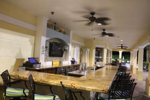a large dining room with a large table and chairs at Viz Cay Apartment 202 in Orlando