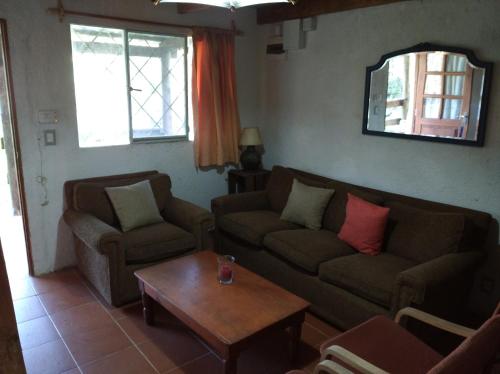a living room with two couches and a coffee table at Al Sur in La Paloma