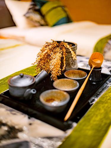 a tray with bowls of food on a table at SAMURAI HOUSE Ⅲ in Nagoya