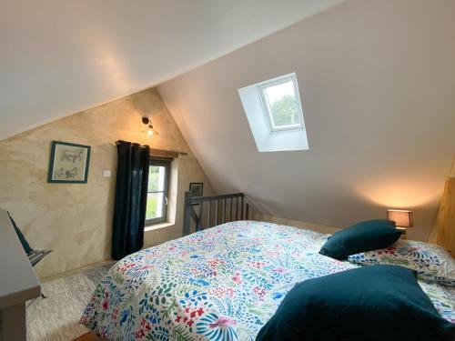 a bedroom with a bed and a window at gite du perche in Bueil