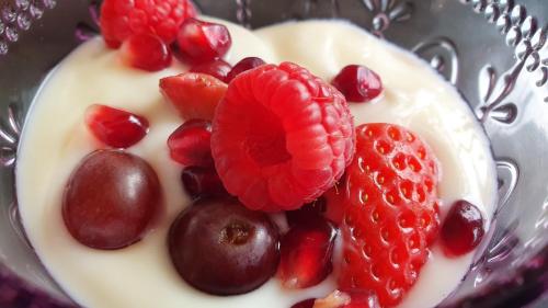 a bowl of fruit with strawberries and cherries at Keret Accommodation in Bellville