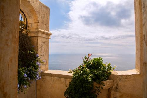a view from a balcony of a balcony overlooking the ocean at Monastero Santa Rosa Hotel & Spa in Conca dei Marini