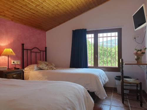 Postel nebo postele na pokoji v ubytování Complejo Rural Las Lomas de Biar