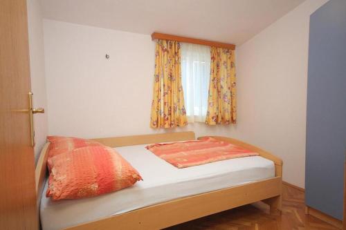 Posteľ alebo postele v izbe v ubytovaní Apartments Vuko