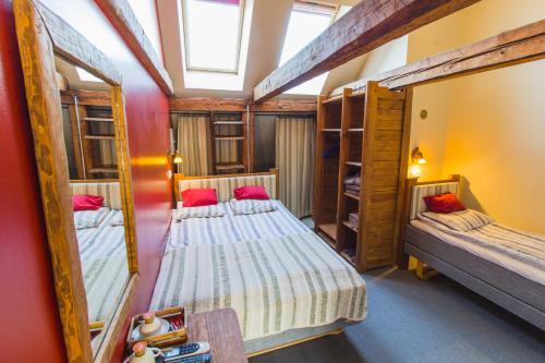 two bunk beds in a room with a mirror at Puhkekodu nr.17 in Võru