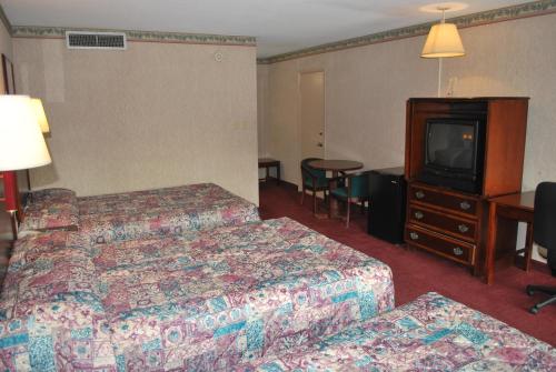 Ένα ή περισσότερα κρεβάτια σε δωμάτιο στο Best Motel Lakeland