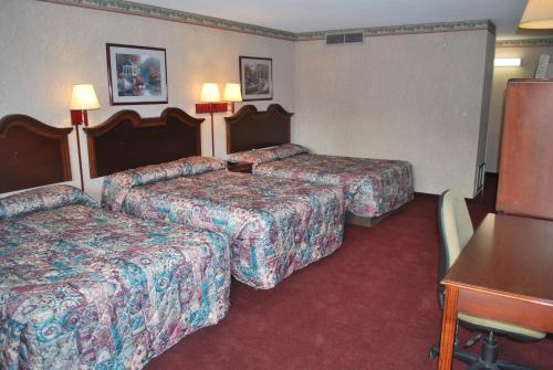 Ένα ή περισσότερα κρεβάτια σε δωμάτιο στο Best Motel Lakeland
