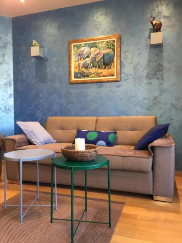 a living room with a couch and a table at Apartman Vasilisa Kalman in Zlatibor