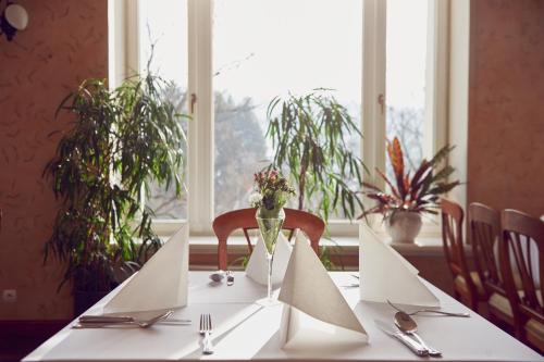 a table with white papers on top of it at Zamek Na Skale in Trzebieszowice