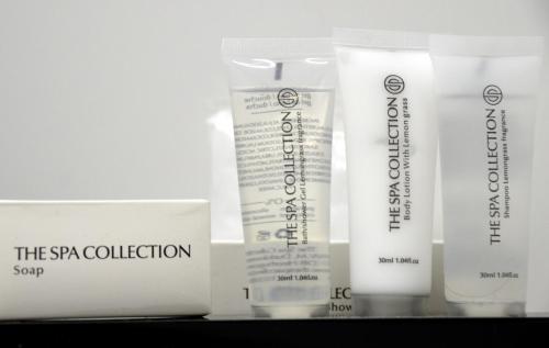 a group of four products sitting on a shelf at Auberge Le Temps des Saveurs in Paliseul