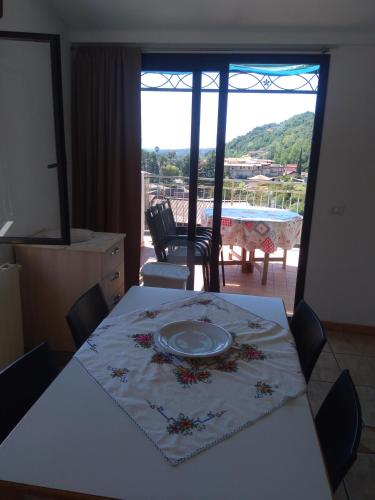 a table with a plate on it in a room with a view at Galatro Terme House in Galatro