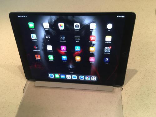 an tablet computer sitting on top of a table at Terrace Apartman Prémium Belváros Jacuzzival in Veszprém