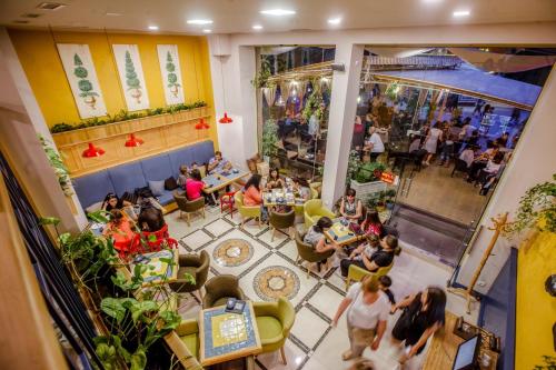 an overhead view of a crowd of people sitting in a restaurant at Boutique ETHNO HOTEL in Gyumri