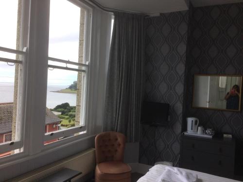 a hotel room with a view of the ocean at Glenleigh Bed and Breakfast in Marazion
