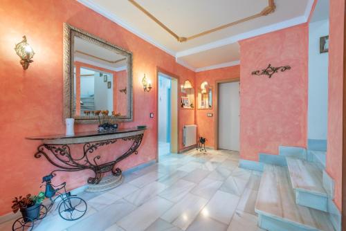 a hallway with a sink and a mirror at Villa Son Ferrer in Santa Ponsa