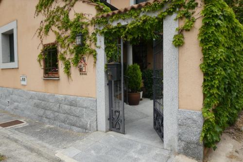 an entrance to a building with an open door at Casa del Portalón in Ituero y Lama